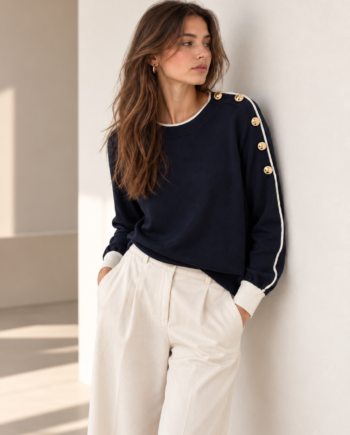 Suéter Artigli negro con contraste blanco y botones dorados para mujer